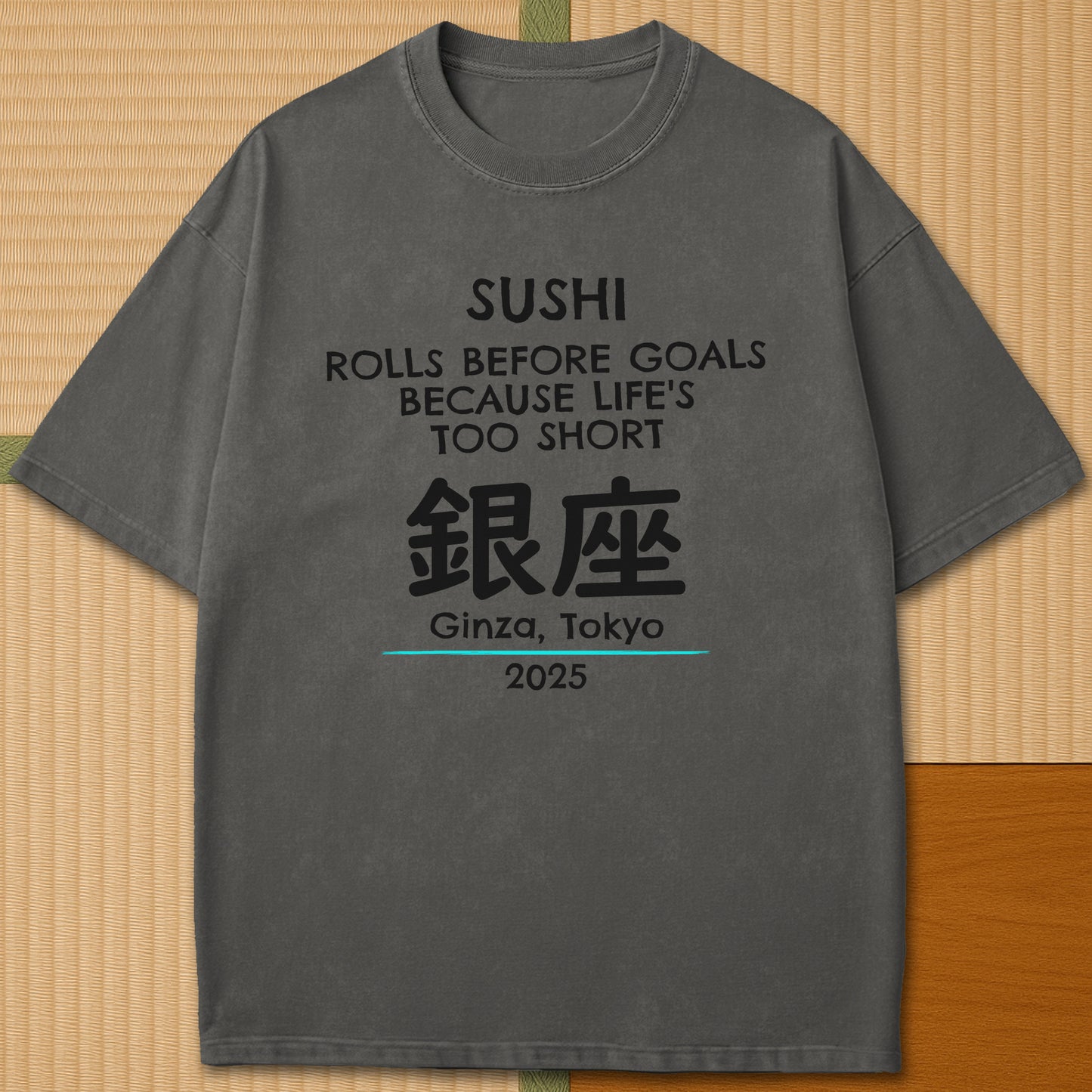 Japanese-inspired cotton Sushi Rolls Before Goals T-Shirt in Pepper on Comfort Colors 1717, styled in a modern flatlay scene.