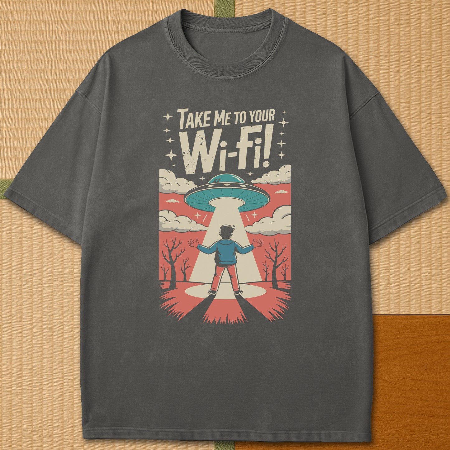 Japanese-inspired cotton Gaijin Abduction T-Shirt in Pepper on Comfort Colors 1717, styled in a modern flatlay scene.