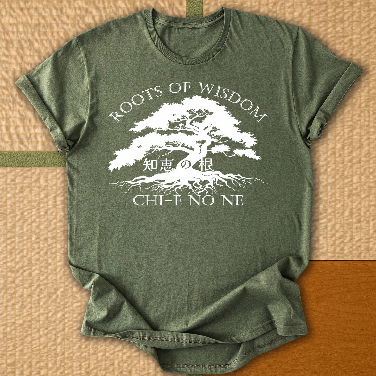 Japanese-inspired cotton Roots of Wisdom T-Shirt in Military Green on Gildan 64000, styled in a modern flatlay scene
