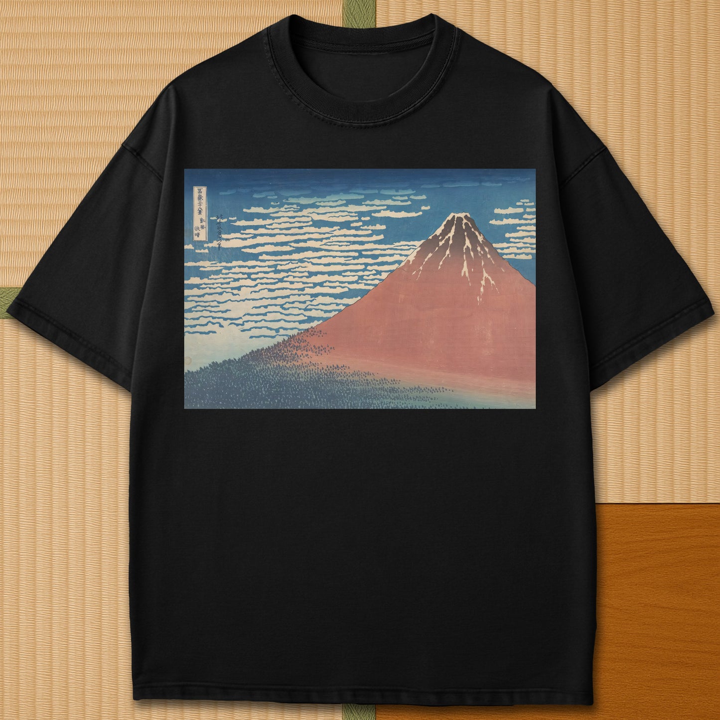Japanese-inspired cotton Red Fuji By Hokusai T-Shirt in Black on Comfort Colors 1717, styled in a modern flatlay scene.