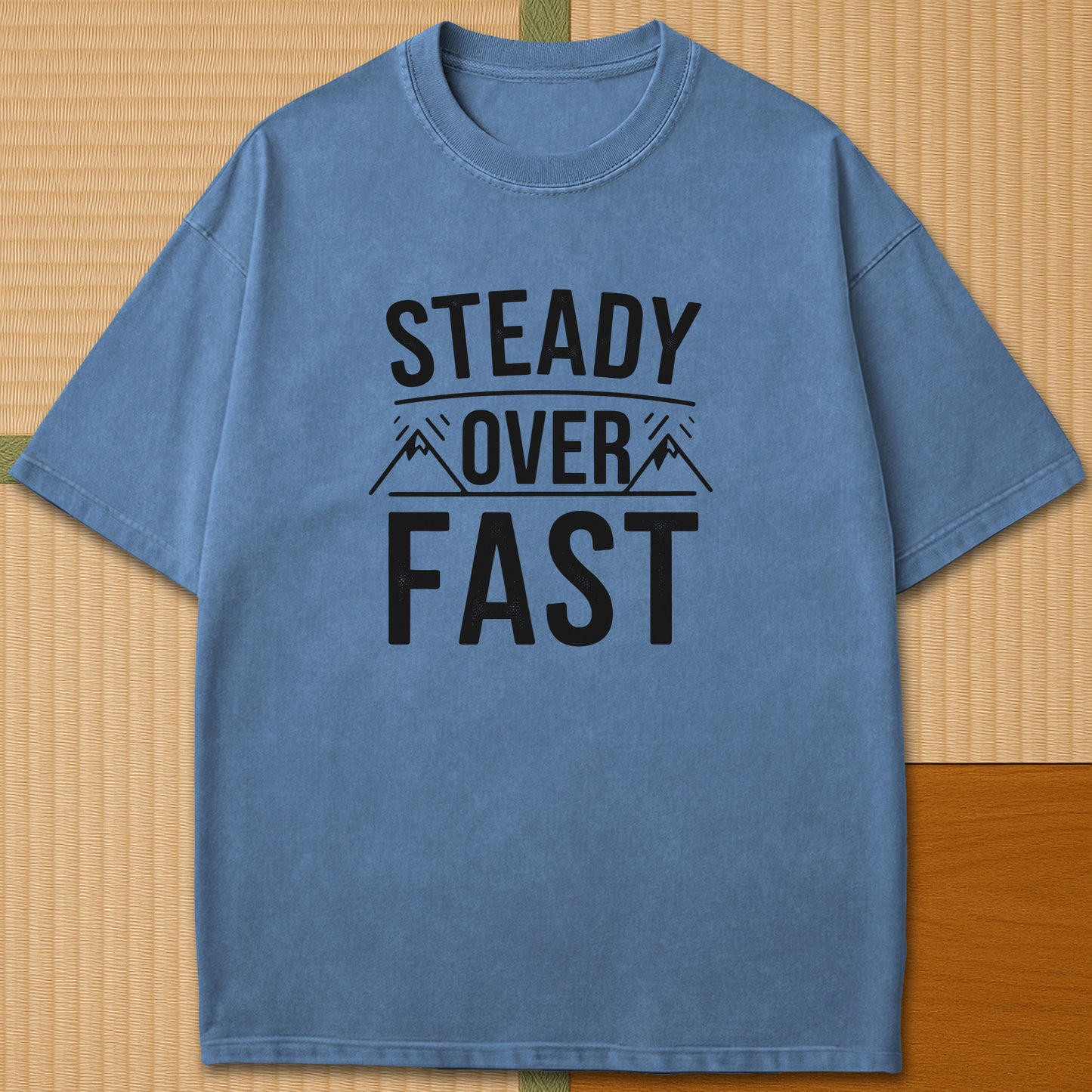 Japanese-inspired cotton Steady Over Fast T-Shirt in Blue Jean on Comfort Colors 1717, styled in a modern flatlay scene.