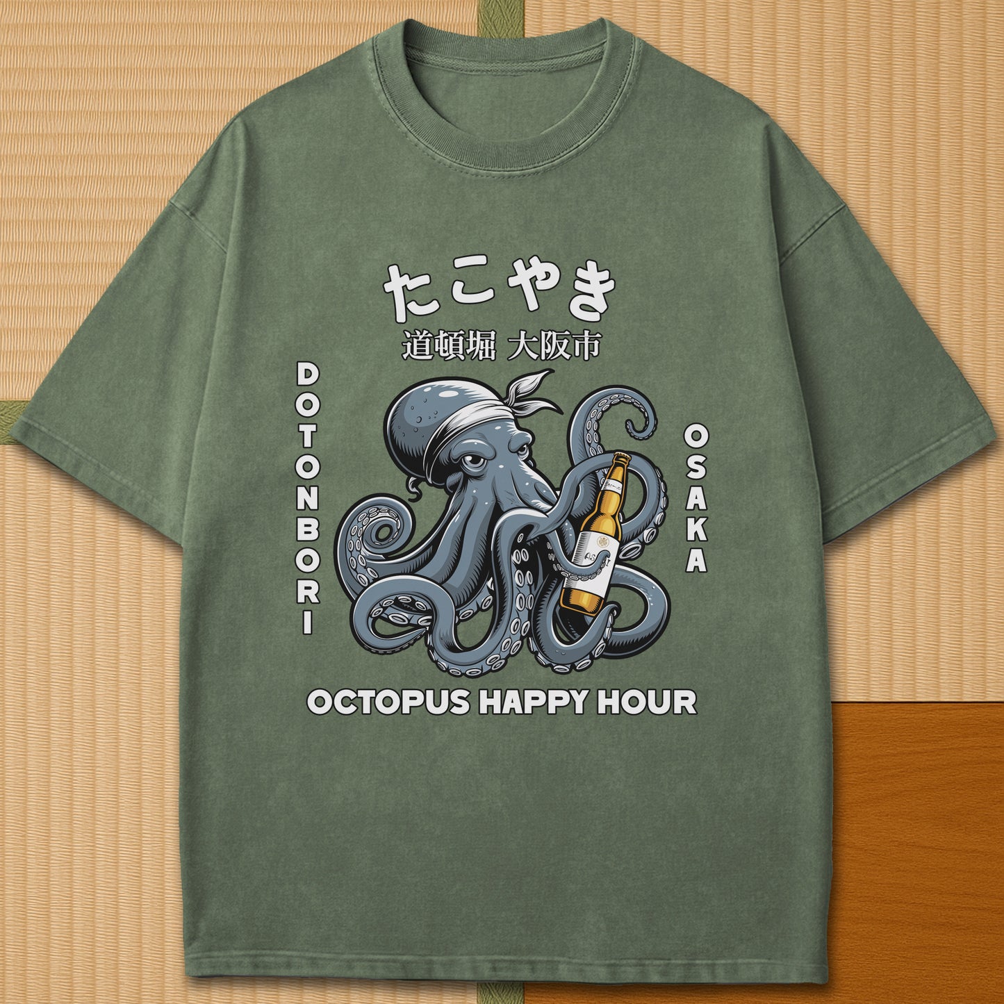Japanese-inspired cotton Dotonbori Takoyaki T-Shirt in Moss on Comfort Colors 1717, styled in a modern flatlay scene.