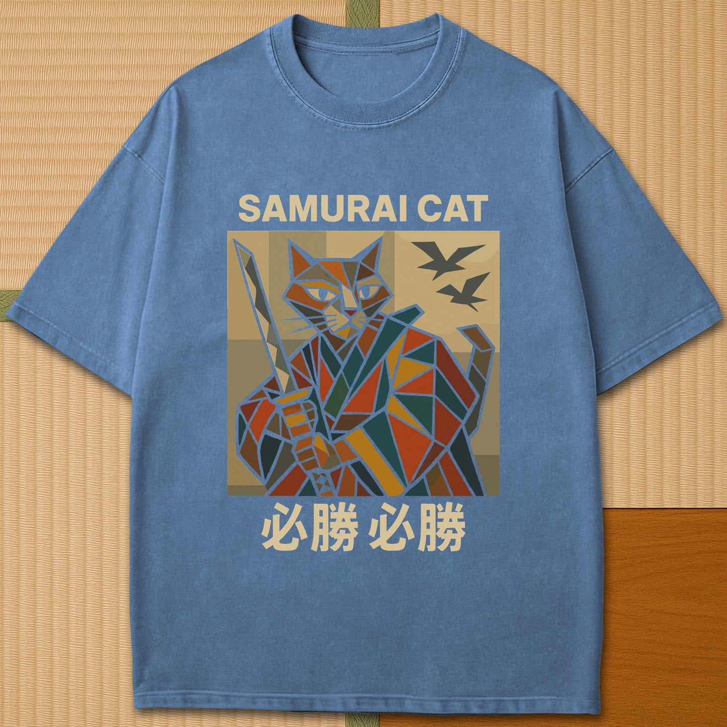 Japanese-inspired cotton Victory Cubist Samurai Cat T-Shirt in Blue Jean on Comfort Colors 1717, styled in a modern flatlay scene.