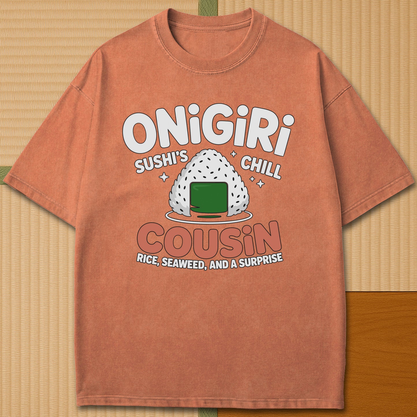 Japanese-inspired cotton Sushis Chill Cousin Onigiri T-Shirt in Yam on Comfort Colors 1717, styled in a modern flatlay scene.