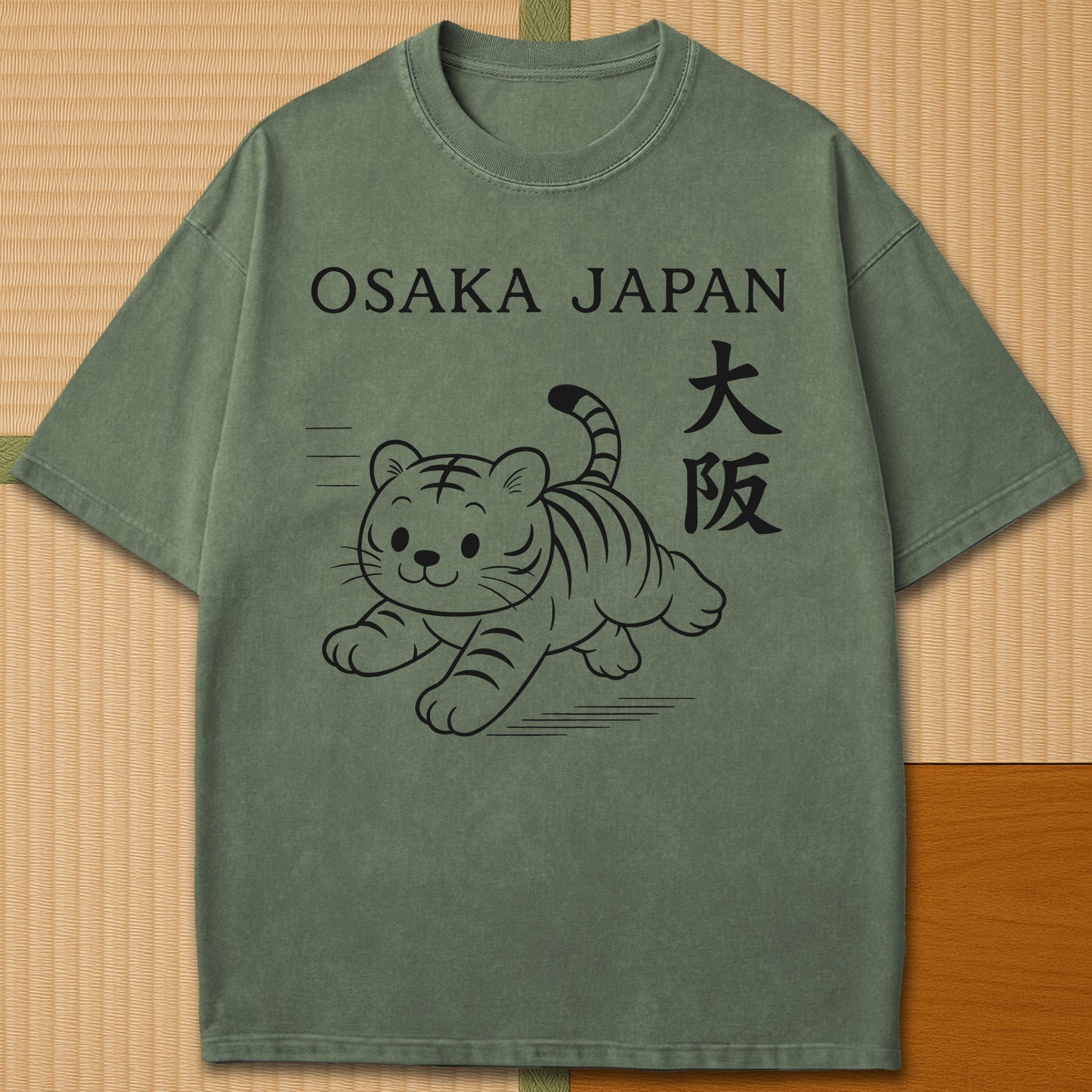 Japanese-inspired cotton Osaka Tiger T-Shirt in Moss on Comfort Colors 1717, styled in a modern flatlay scene.