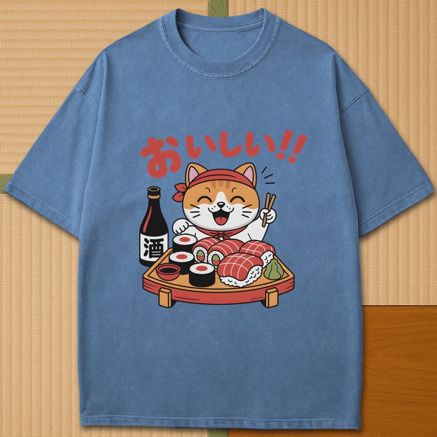 Japanese-inspired cotton Cute Cat And Sushi T-Shirt in Blue Jean on Comfort Colors 1717, styled in a modern flatlay scene.