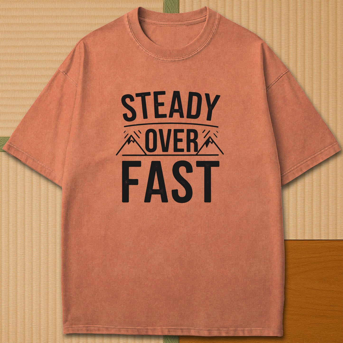 Japanese-inspired cotton Steady Over Fast T-Shirt in Yam on Comfort Colors 1717, styled in a modern flatlay scene.