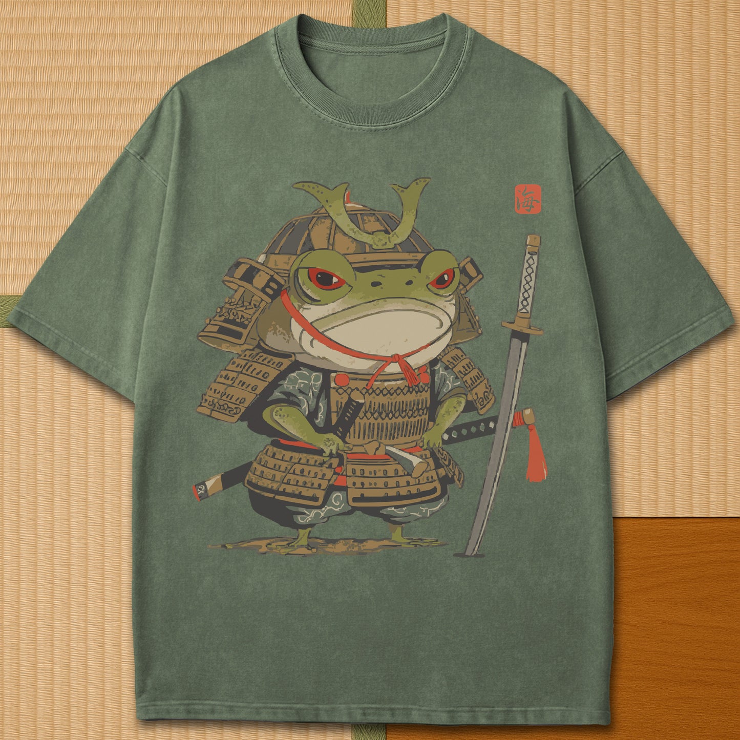 Japanese-inspired cotton Anime Frog Samurai T-Shirt in Moss on Comfort Colors 1717, styled in a modern flatlay scene.
