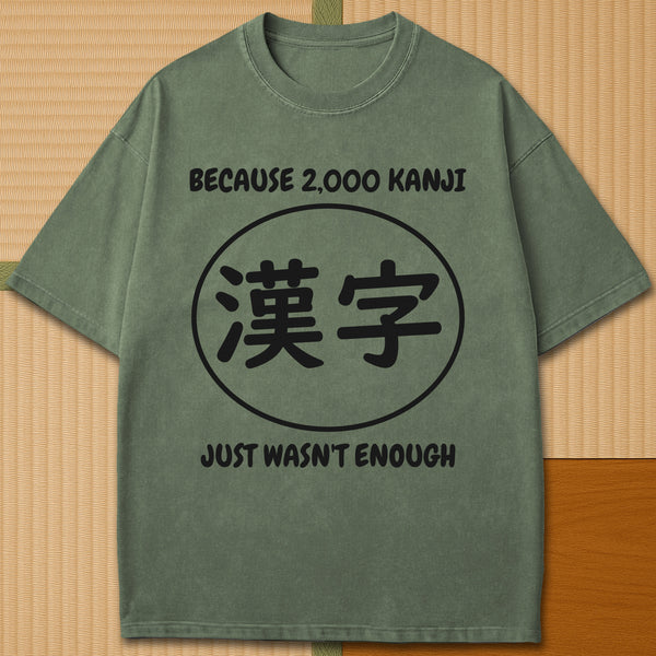 Japanese-inspired cotton Never Enough Kanji T-Shirt in Moss on Comfort Colors 1717, styled in a modern flatlay scene.