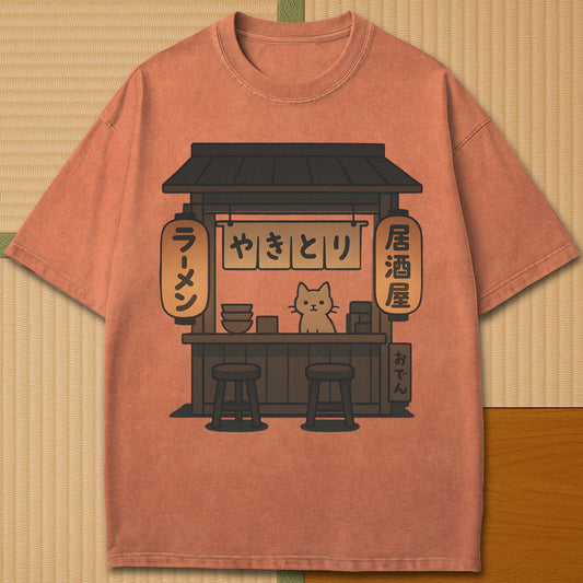 Japanese-inspired cotton Cozy Cat At Japanese Yatai T-Shirt in Yam on Comfort Colors 1717, styled in a modern flatlay scene.