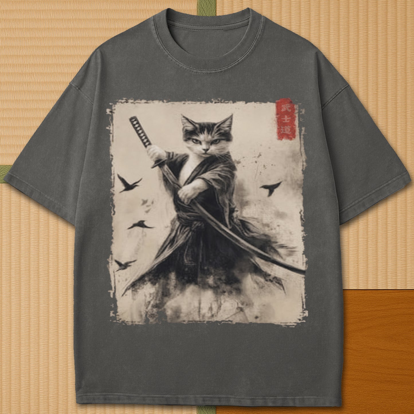 Japanese-inspired cotton Cat Samurai T-Shirt in Pepper on Comfort Colors 1717, styled in a modern flatlay scene.