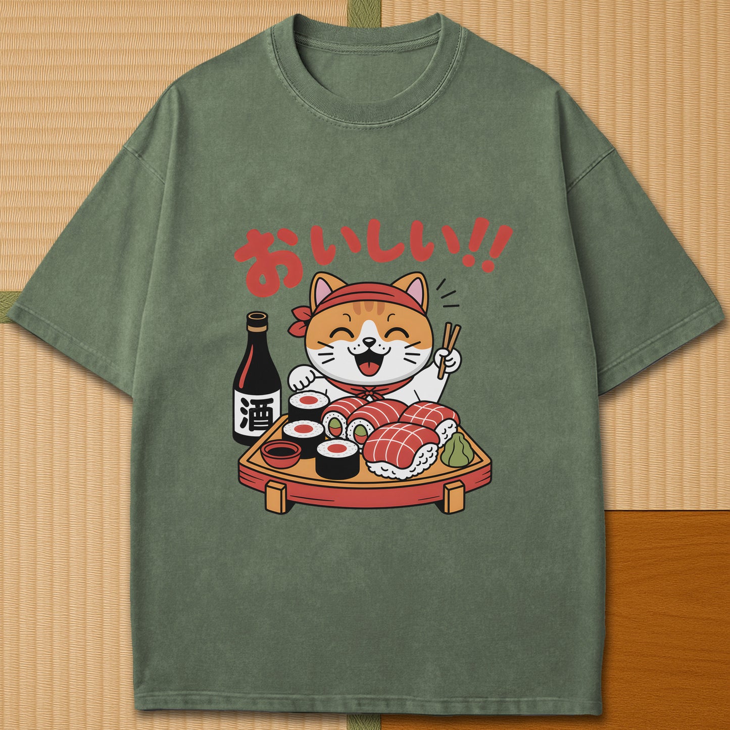 Japanese-inspired cotton Cute Cat And Sushi T-Shirt in Moss on Comfort Colors 1717, styled in a modern flatlay scene.