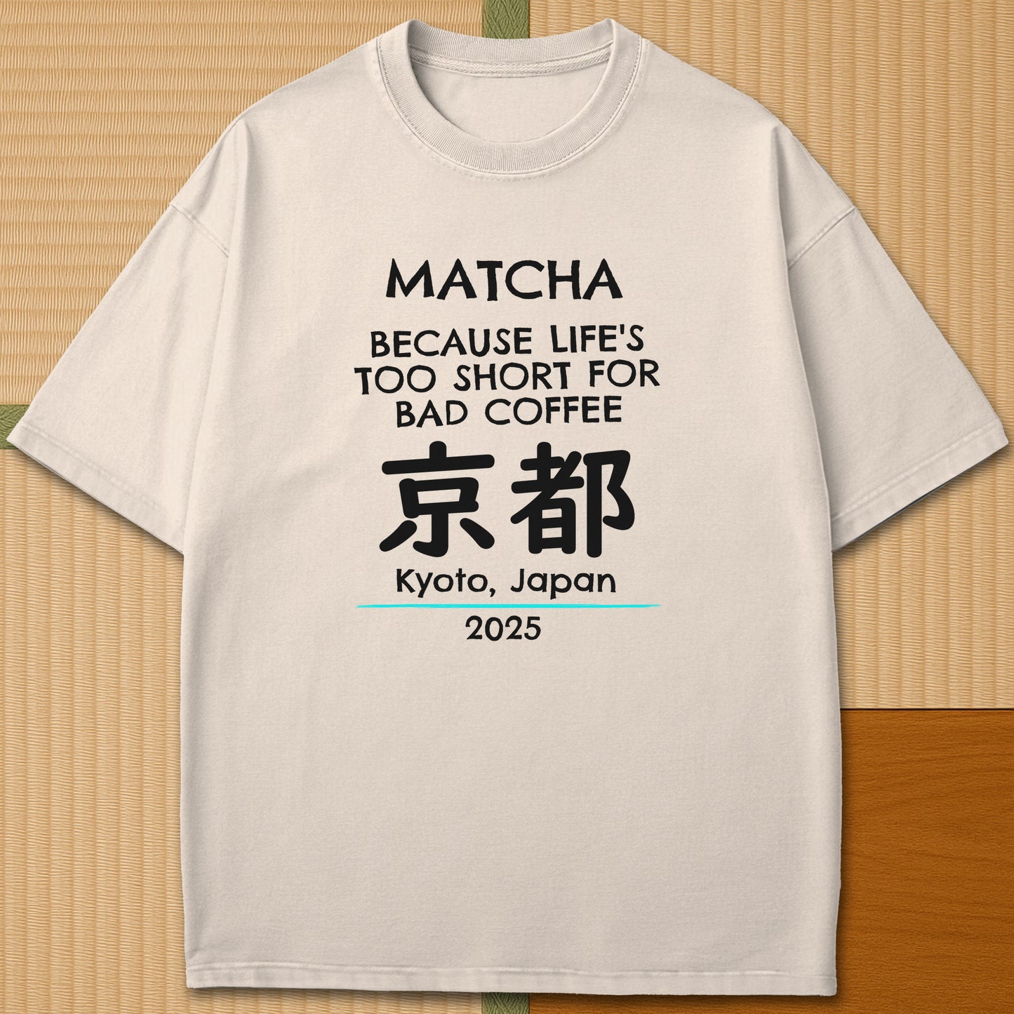 Japanese-inspired cotton Matcha Tokyo T-Shirt in Ivory on Comfort Colors 1717, styled in a modern flatlay scene.