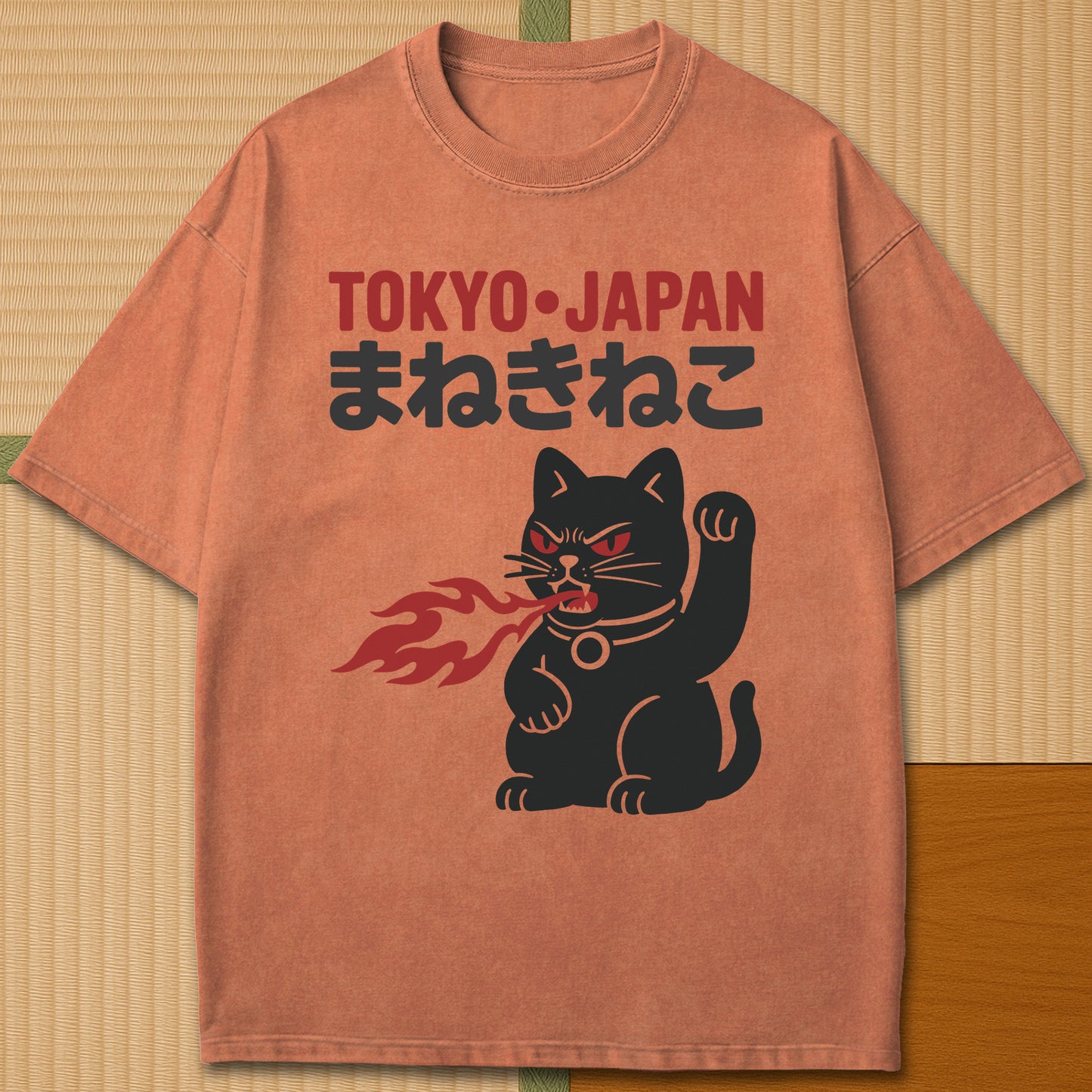 Japanese-inspired cotton Maneki Neko Monster T-Shirt in Yam on Comfort Colors 1717, styled in a modern flatlay scene.