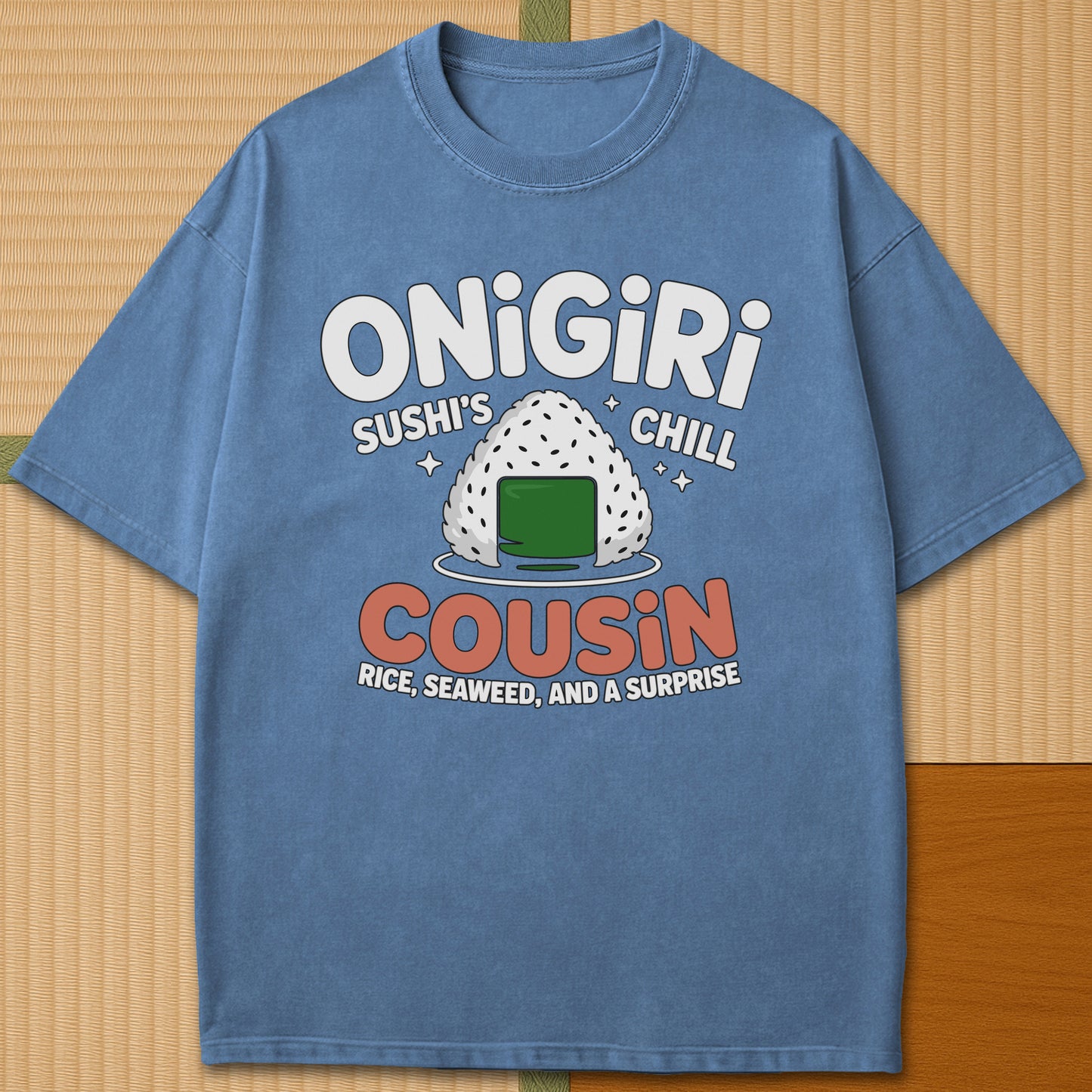 Japanese-inspired cotton Sushis Chill Cousin Onigiri T-Shirt in Blue Jean on Comfort Colors 1717, styled in a modern flatlay scene.
