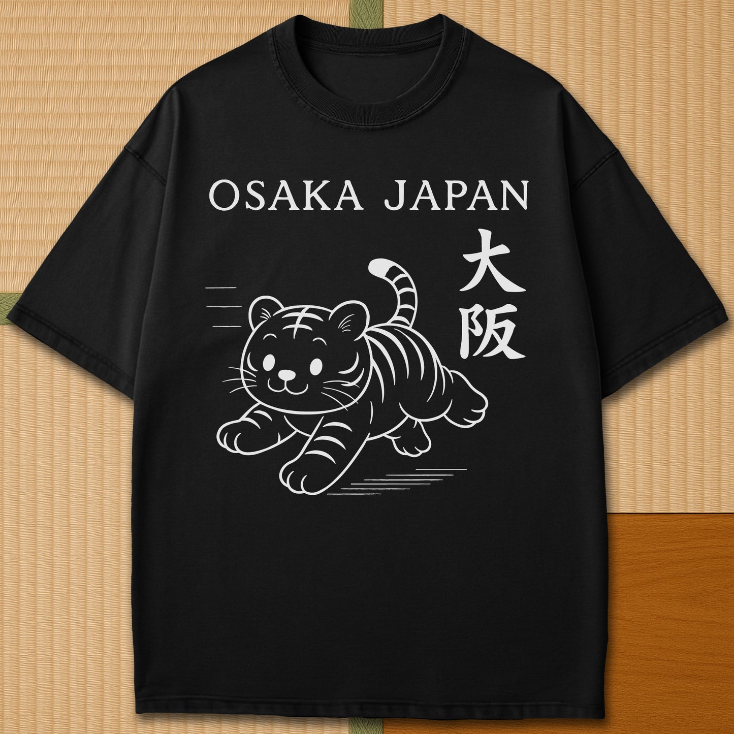 Japanese-inspired cotton Osaka Tiger T-Shirt in Black on Comfort Colors 1717, styled in a modern flatlay scene.